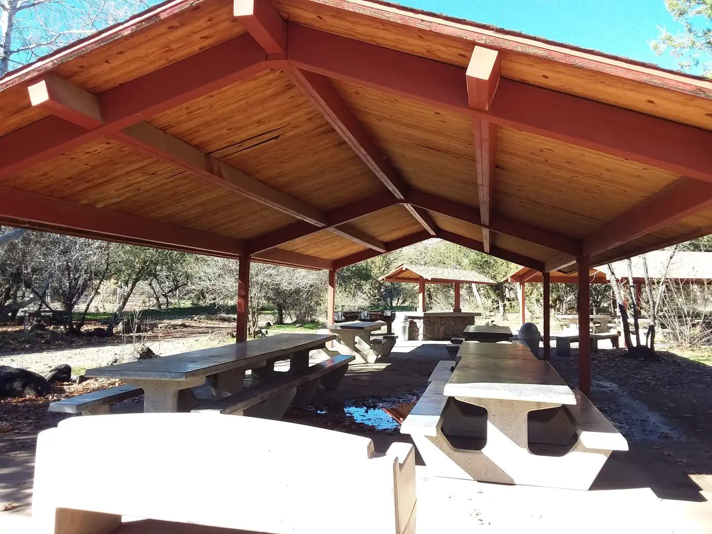 Covered ramada with stone picnic tables